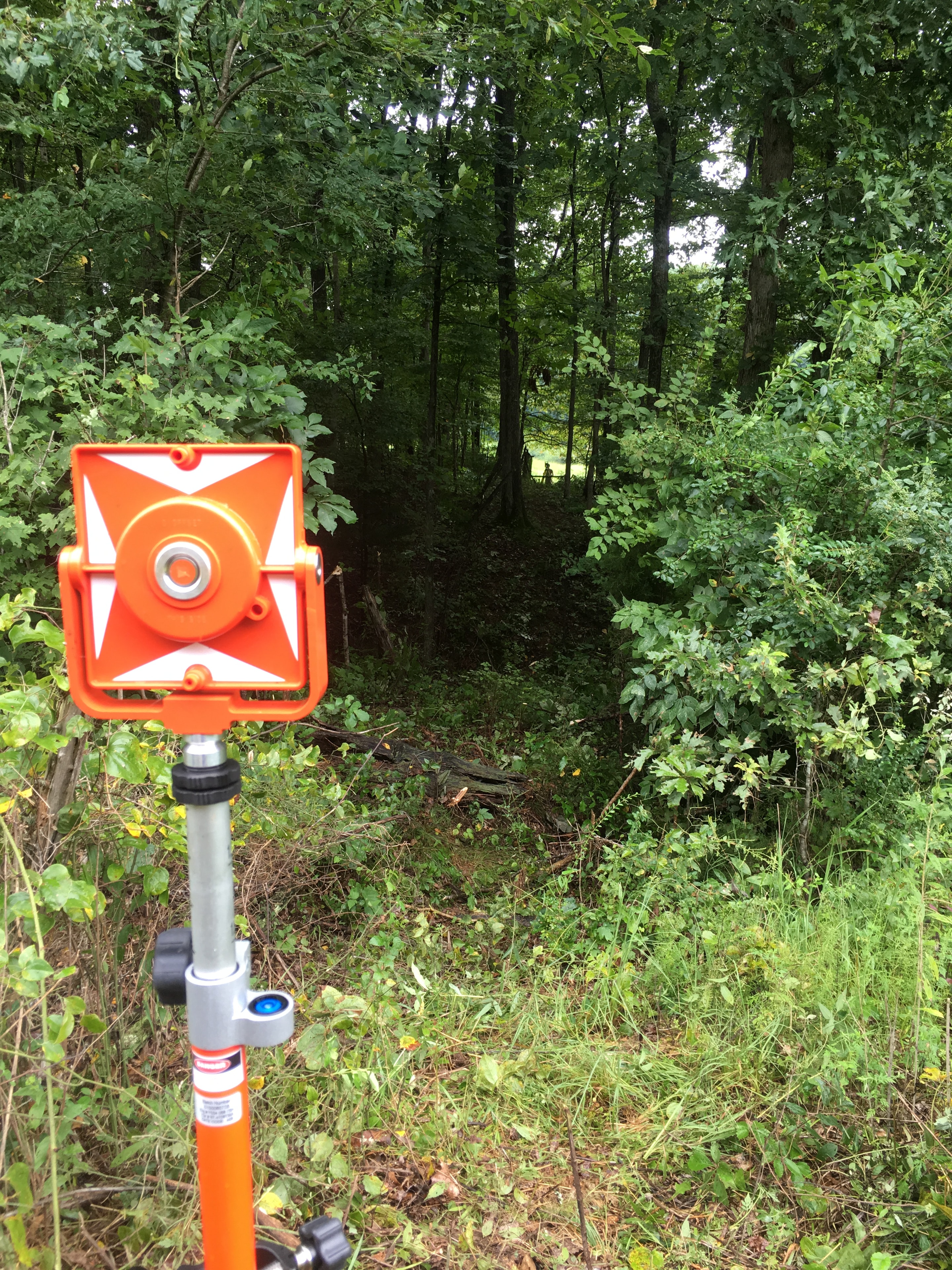 Surveying instrument in mountain landscape